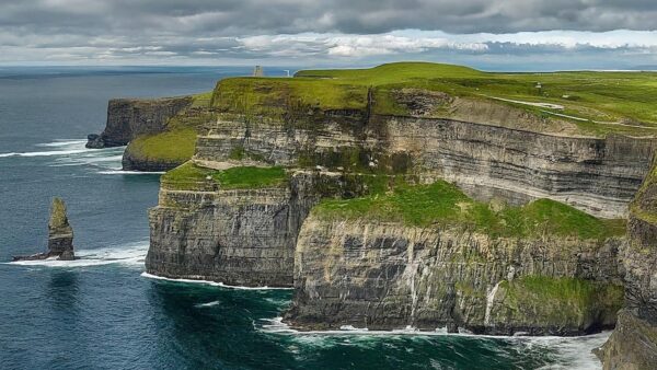 Cliffs of Moher chauffeur driving tour - image showing the cliffs and lighthouse