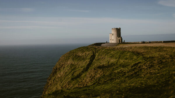 A photo of O'Brien's Tower on the Cliffs of Moher, looking out to see on a sunny day.