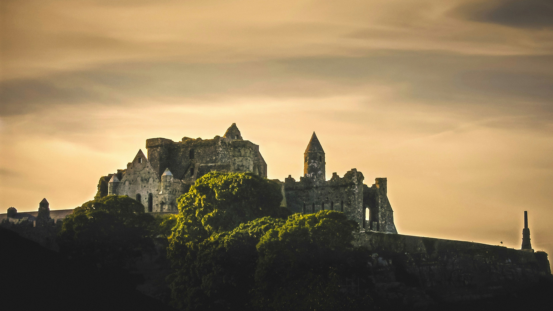 An atmospheric photograph of The Castle on The Rock of Cashel, Co. Tipperary, Ireland - Chauffeur Driven Tours of Ireland