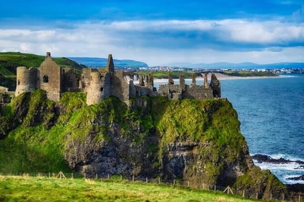 A photo of Dunluce Castle, Northern Ireland, which is included in our Giant's Causeway and Belfast private chauffeur tour itinerary