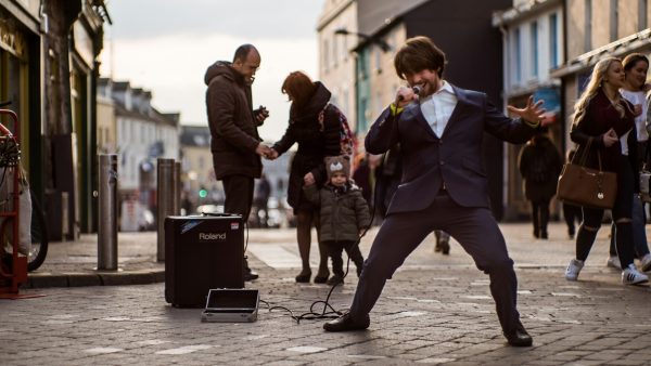 A busker in Galway City, enjoy our 2-day Connemara and Galway City private Chauffeur tour.