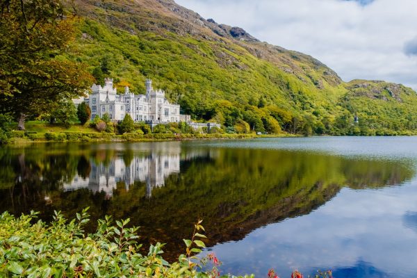 The incredible Kylemore Abbey and lake, included in our 2-day Connemara Lakes and Galway City private chauffeur tour.