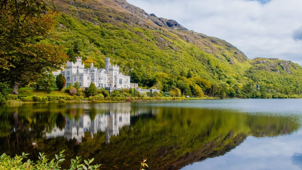The incredible Kylemore Abbey and lake, included in our 2-day Connemara Lakes and Galway City private chauffeur tour.