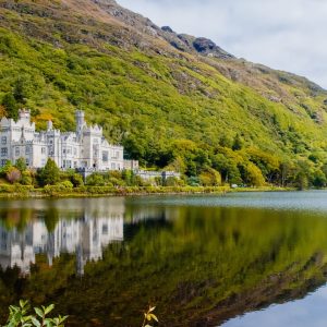 The incredible Kylemore Abbey and lake, included in our 2-day Connemara Lakes and Galway City private chauffeur tour.