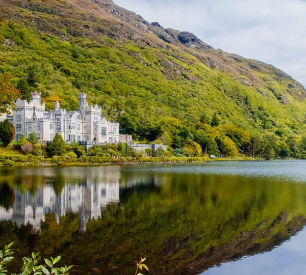 The incredible Kylemore Abbey and lake, included in our 2-day Connemara Lakes and Galway City private chauffeur tour.