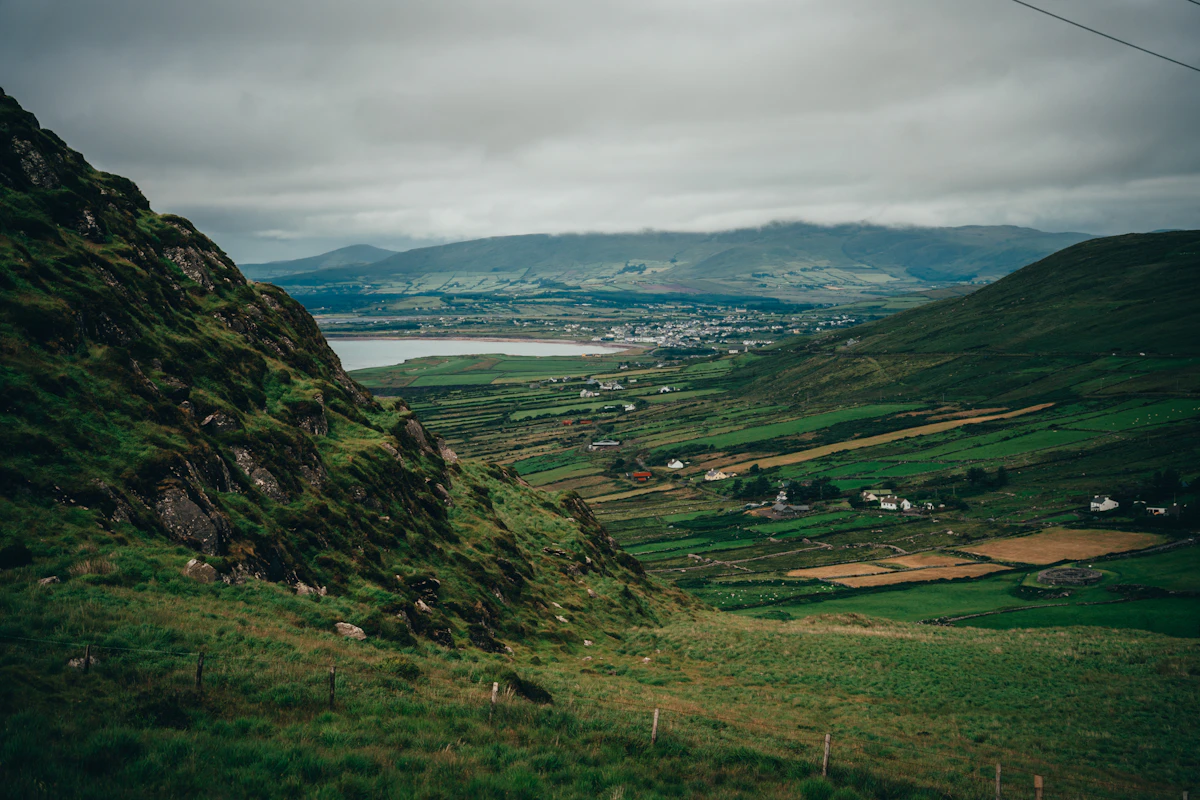 Ireland green valley and coastal village best season for American travelers